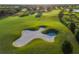 Green golf course view of sand trap at 15520 Castle Park Ter, Lakewood Ranch, FL 34202