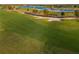 Scenic golf course with pristine greens, lush landscaping, and waterfront views at 15520 Castle Park Ter, Lakewood Ranch, FL 34202