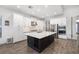 Gourmet kitchen featuring custom cabinets, stainless steel appliances, and a spacious center island at 15520 Castle Park Ter, Lakewood Ranch, FL 34202