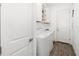 Well-lit laundry room featuring white cabinets, a washer, and a dryer at 15520 Castle Park Ter, Lakewood Ranch, FL 34202