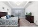 Spacious main bedroom features tray ceilings, neutral paint colors, and a large window at 15520 Castle Park Ter, Lakewood Ranch, FL 34202