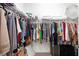 Spacious walk-in closet with ample hanging space and built-in shelving for organized storage at 15520 Castle Park Ter, Lakewood Ranch, FL 34202
