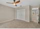 Neutral bedroom with light gray walls and an adjoining room visible through the doorway at 1705 Wharf Rd, Sarasota, FL 34231