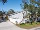 Charming home featuring a well-maintained yard with white fence at 1705 Wharf Rd, Sarasota, FL 34231
