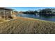 Lawn sloping to a lake with a waterfront view at 1842 Country Meadows Ct, Sarasota, FL 34235
