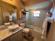 Bathroom featuring modern fixtures, a soaking tub, and stylish decor, including decorative shells at 1842 Country Meadows Ct, Sarasota, FL 34235