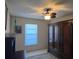 This bedroom features a ceiling fan and an armoire closet at 1842 Country Meadows Ct, Sarasota, FL 34235
