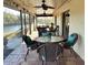 Outdoor dining set on patio overlooking a lake at 1842 Country Meadows Ct, Sarasota, FL 34235