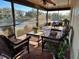 Comfortable patio furniture with a view of the lake at 1842 Country Meadows Ct, Sarasota, FL 34235