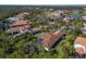 Panoramic aerial shot showcasing a luxurious home with lush landscaping and a screened pool in a beautiful neighborhood at 19424 Ganton Ave, Lakewood Ranch, FL 34202