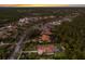 Lush neighborhood with mature trees, manicured lawns, a lake, and several well-kept homes at 19424 Ganton Ave, Lakewood Ranch, FL 34202