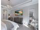 Bright bedroom with a view to the pool area features neutral tones and a walk out to the pool at 19424 Ganton Ave, Lakewood Ranch, FL 34202