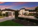Elegant home with a paver driveway, a manicured lawn, and a three-car garage at 19424 Ganton Ave, Lakewood Ranch, FL 34202