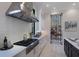 Bright kitchen featuring a large island, stainless steel appliances, and ample counter space at 19424 Ganton Ave, Lakewood Ranch, FL 34202