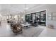 Expansive living room featuring tile floors, stylish furnishings, and views of the pool at 19424 Ganton Ave, Lakewood Ranch, FL 34202