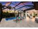 Inviting screened pool area featuring lounge chairs and a basketball hoop for outdoor recreation at 19424 Ganton Ave, Lakewood Ranch, FL 34202