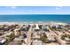 Breathtaking aerial view of beach homes showcasing the neighborhood's close proximity to the ocean at 204 66Th Street, Holmes Beach, FL 34217
