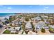 Coastal home featuring a metal roof with balconies offers easy access to the beach and local amenities at 204 66Th Street, Holmes Beach, FL 34217