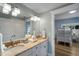 Bright bathroom with double sinks, marble countertops, and ample storage space at 204 66Th Street, Holmes Beach, FL 34217