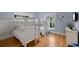 Cozy bedroom with two sets of bunk beds, wood flooring, and ample natural light at 204 66Th Street, Holmes Beach, FL 34217