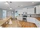 Spacious open-concept kitchen is great for entertaining and boasts stainless steel appliances at 204 66Th Street, Holmes Beach, FL 34217