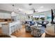 Charming living space connects the kitchen, breakfast, and seating areas, perfect for entertaining at 204 66Th Street, Holmes Beach, FL 34217