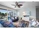 Comfortable living room features stylish furniture, a ceiling fan, and a flat-screen TV at 204 66Th Street, Holmes Beach, FL 34217