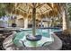Unique private pool with a tiki hut and table for a great outdoor entertaining space for Gathering and friends at 204 66Th Street, Holmes Beach, FL 34217