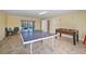 Recreation room featuring a ping pong table, foosball table, and comfortable seating area at 204 66Th Street, Holmes Beach, FL 34217