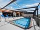 Relax in this pool with brick trim and ample seating space in a screened enclosure at 2129 Harbourside Dr # 901, Longboat Key, FL 34228