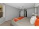 Neutral bedroom with ceiling fan, plush carpet, and an orange throw blanket at 2247 Otter Creek Ln, Sarasota, FL 34240