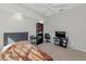 Bedroom features plush carpet, ceiling fan, and a dark wood bookshelf and desk at 2247 Otter Creek Ln, Sarasota, FL 34240