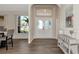 Inviting foyer featuring a decorative front door and views into the dining room at 2247 Otter Creek Ln, Sarasota, FL 34240