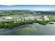 Breathtaking aerial view of waterfront condos with expansive green spaces, golf course, and community pier at 2625 Terra Ceia Bay Blvd # 504, Palmetto, FL 34221