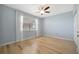 Bright bedroom features a ceiling fan, window, and light wood floors at 2625 Terra Ceia Bay Blvd # 504, Palmetto, FL 34221