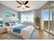 Bright primary bedroom with stylish decor, balcony access, and water views at 2625 Terra Ceia Bay Blvd # 504, Palmetto, FL 34221