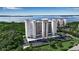 Beautiful waterfront condo building with lush landscaping, covered parking, and views of the bay at 2625 Terra Ceia Bay Blvd # 504, Palmetto, FL 34221