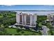 Beautiful waterfront condo building with lush landscaping, covered parking, and views of the bay at 2625 Terra Ceia Bay Blvd # 504, Palmetto, FL 34221
