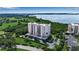 Beautiful waterfront condo building with lush landscaping, covered parking, and views of the bay at 2625 Terra Ceia Bay Blvd # 504, Palmetto, FL 34221