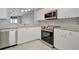 Bright kitchen featuring granite countertops, stainless steel appliances and ample white cabinetry at 2625 Terra Ceia Bay Blvd # 504, Palmetto, FL 34221