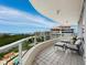 Spacious balcony with lounge seating providing stunning views of the water and surrounding landscape at 3010 Grand Bay Blvd # 482, Longboat Key, FL 34228