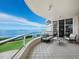Private balcony with seating and views of the ocean, golf course and city skyline at 3010 Grand Bay Blvd # 482, Longboat Key, FL 34228