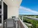 Cozy balcony with table and seating, boasting panoramic views of the landscape and skyline at 3010 Grand Bay Blvd # 482, Longboat Key, FL 34228