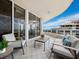 Outdoor seating on balcony with ocean view at 3010 Grand Bay Blvd # 482, Longboat Key, FL 34228