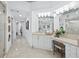 Elegant bathroom featuring a vanity with a marble countertop and decorative lighting at 3010 Grand Bay Blvd # 482, Longboat Key, FL 34228