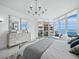 Bright main bedroom featuring water view, modern furniture, and ample natural light at 3010 Grand Bay Blvd # 482, Longboat Key, FL 34228