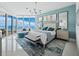 Luxurious main bedroom boasting water view, modern decor, and ample natural light at 3010 Grand Bay Blvd # 482, Longboat Key, FL 34228