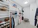 Walk-in closet with custom shelving and ample storage space for clothes and accessories at 3010 Grand Bay Blvd # 482, Longboat Key, FL 34228