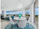 Bright dining room with chandelier and ocean views at 3010 Grand Bay Blvd # 482, Longboat Key, FL 34228