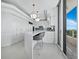 Modern kitchen with white cabinets and island at 3010 Grand Bay Blvd # 482, Longboat Key, FL 34228